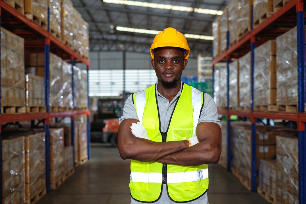 Black,Factory,Engineer,Standing,Arms,Crossed,Wearing,Hardhat,And,Safety Black,Factory,Engineer,Standing,Arms,Crossed,Wearing,Hardhat,And,Safety